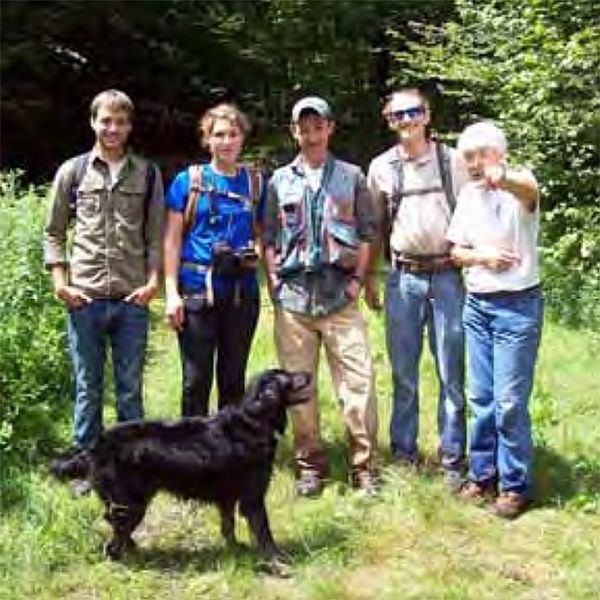 Photo of a group of people with a dog